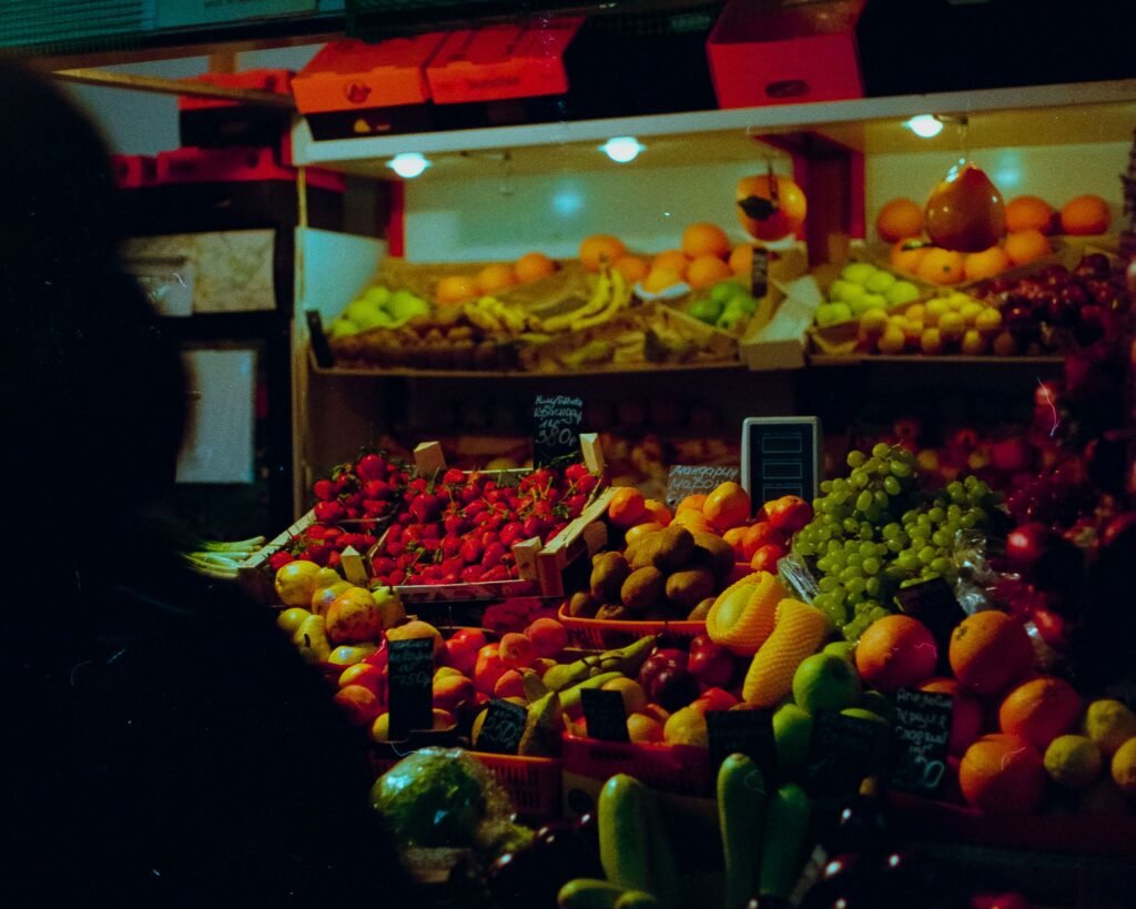 Colorful display of fresh fruits at a bustling Moscow marketplace. Ideal for food and travel themes.