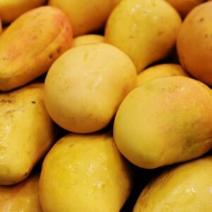 Home Vibrant pile of fresh ripe mangoes showcasing tropical sweetness and summer freshness.